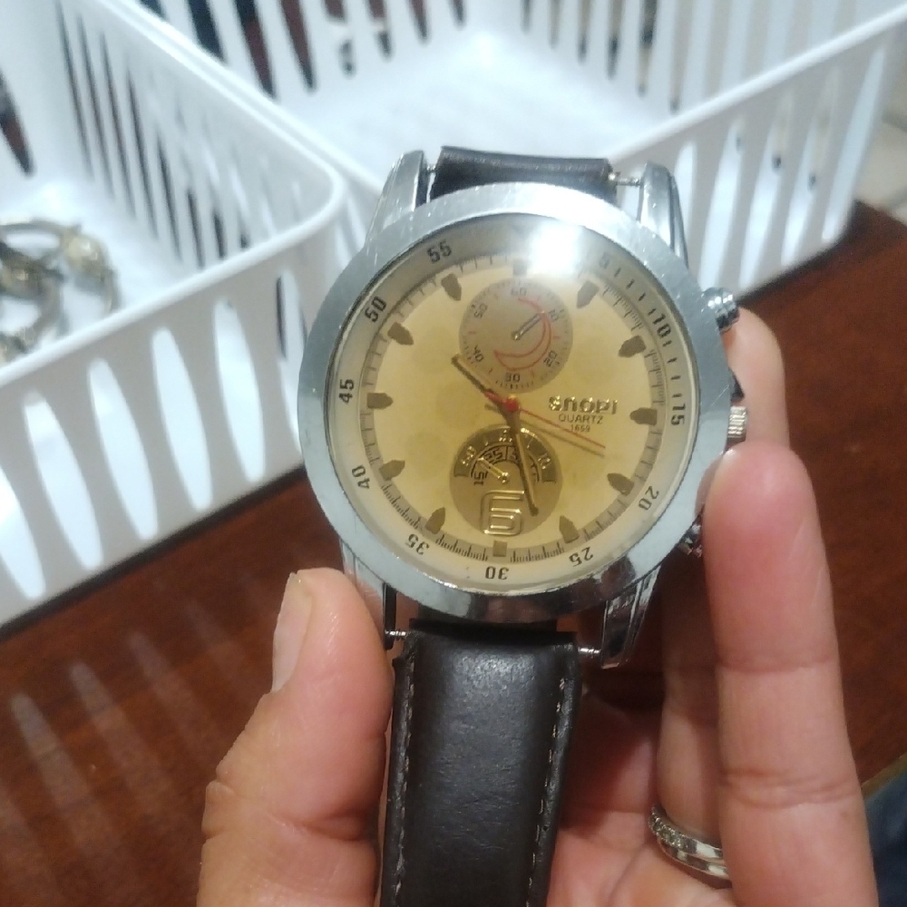 Gold Dial Watch with Black Leather Strap